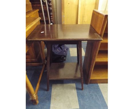 An Edwardian Oak Rectangular Top Table with Stretcher Shelf.