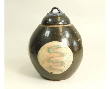 TREVOR CORSER. A Trevor Corser lidded jar with four resist, slip decorated circular panels. Height 24cm. Personal &amp; Leach
