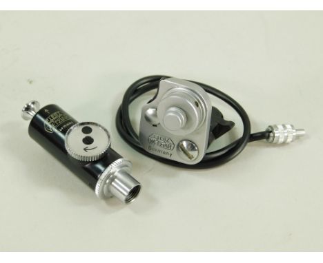 FLASH SYNCHRONISER &amp; SELF TIMER. A Leitz Vacu flash synchronisation button &amp; an Appdoo self-timer.