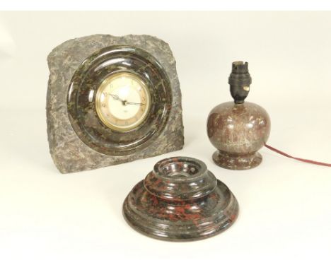 CORNISH SERPENTINE. A large turned Cornish serpentine mantle clock with electric movement, H.22 x W.23cm. Also an antique red