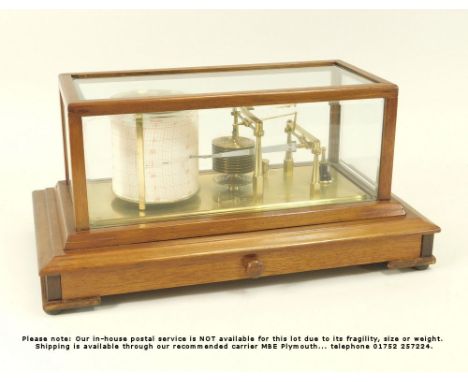 BAROGRAPH. A mahogany cased barograph by Negretti &amp; Zambra, London. R/4693. The drawer with spare sheets for the drum, Ne