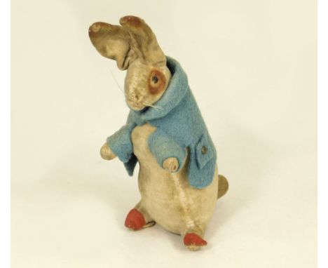 PETER RABBIT. A Steiff-type Peter Rabbit with printed velvet body, black glass bead eyes &amp; whiskers. The blue felt coat h