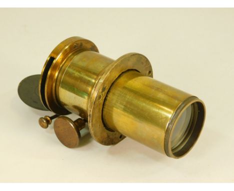 MAGIC LANTERN LENS. An 8 inch magic lantern lens marked with cross keys trade mark &amp; 'Reg. No. 243577'. Also two portrait