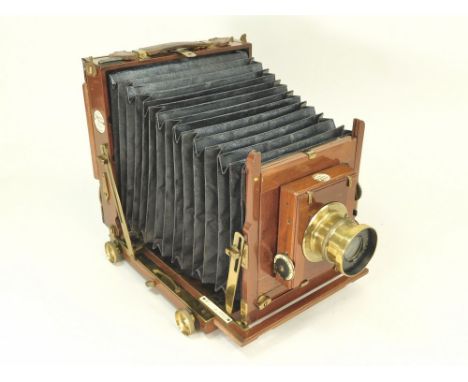 THORNTON PICKARD CAMERA. A mahogany &amp; brass plate camera labelled 'Thornton Pickard Ruby'. Lens marked 'Beck Symmetrical 