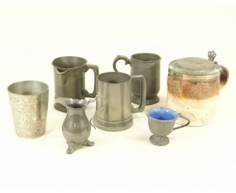 PEWTER ETC. Four pewter measures or drinking vessels including a ceramic lined pewter cup. Also, a stoneware tankard with sil