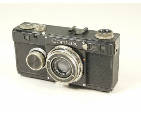 ZEISS IKON. A Zeiss Icon Contax I with Tessar f3.5 50mm lens No. 1272127 with Contax guide book All cameras are untested &amp