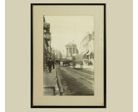 PHOTOGRAPH. A reproduction of an old photographic print of Market Jew Street, Penzance. Image size 39 x 24.5cm.