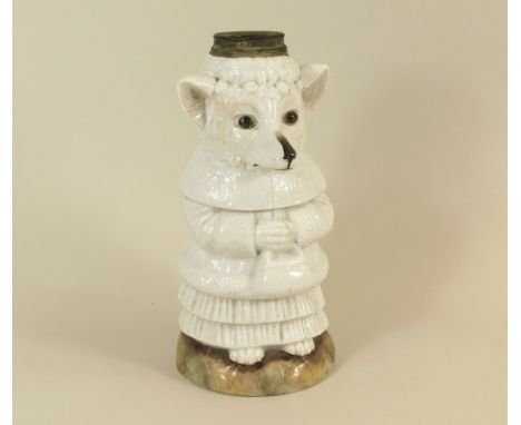 PORCELAIN LAMP BASE. A German porcelain oil lamp base, a wolf in clothing, probably after the child's tale Little Red Riding 