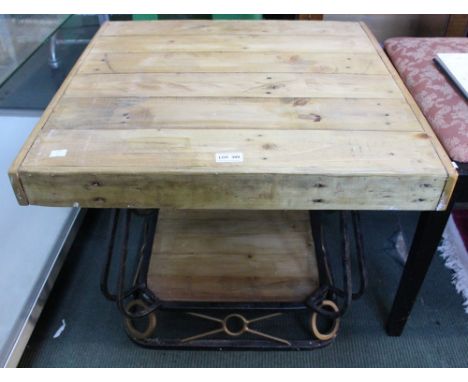 A metal framed pine topped side table
