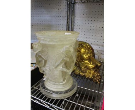 A gilt 'putto head' wall bracket and an ornate perspex putti vase table lamp