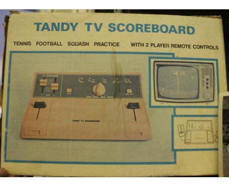 A boxed original 'Tandy' retro TV games console (battery powered)