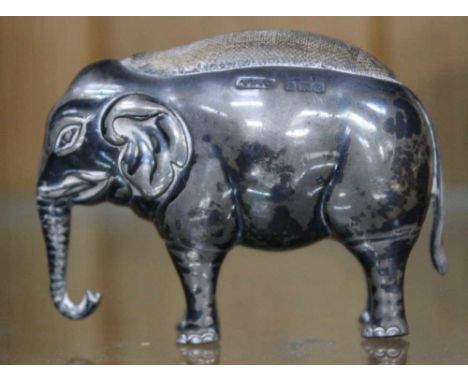 A hallmarked silver Elephant pin cushion, 5.5cm high Condition: in need of a good clean, there are dents, includes large dent