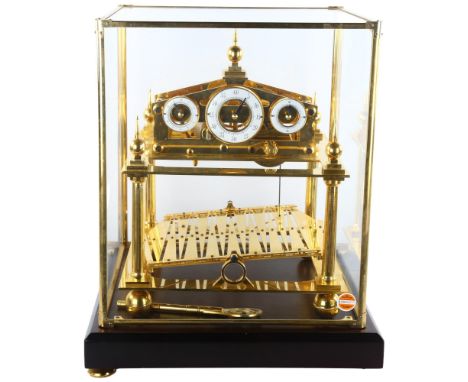 A 20th century brass Congreve clock, with rolling ball fusee movement housed in glass display cabinet, height 50cm, base 41cm