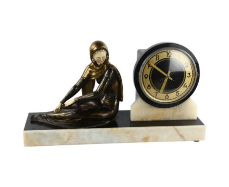 An Art Deco clock on marble base with bronzed and gilded metal figure, length 50cmIn working order, overall good Vintage cond