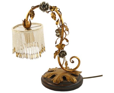 A 1960s gilded metal creeping rose design lamp with beaded shade, height 35cmSlight loss of some beads, otherwise overall goo