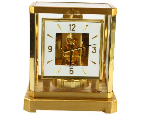 JAEGER LECOULTRE - a gilt-brass Atmos clock, square white lacquered dial with quarterly Arabic numerals and glass panelled ca