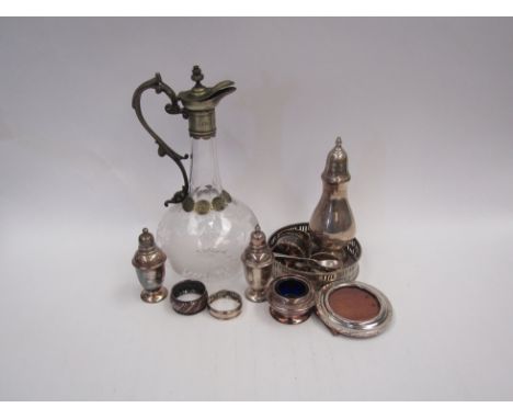 A selection of plated wares including a claret jug with grape and vine etched decoration, wine bottle coaster, sugar sifter e