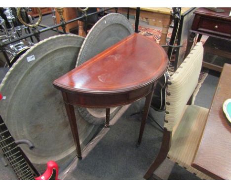 A 19th Century mahogany demilune card table, satinwood cross banded, square tapering legs to castors 