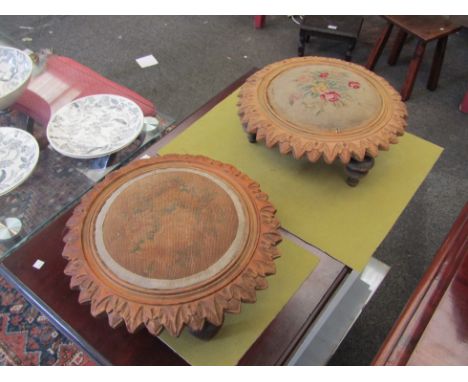 A pair of carved oak footstools with tapestry tops, a/f (2) 