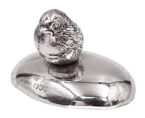 Edwardian silver finial, modelled as a hatching chick, mounted upon a filled silver oval base, both hallmarked Sampson Mordan