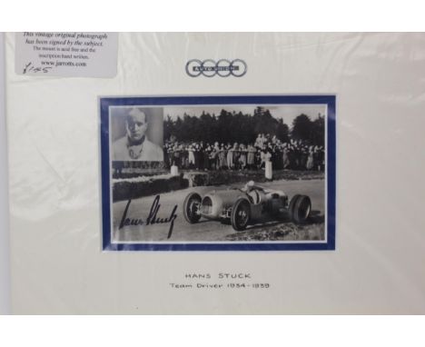 A vintage signed photographic print of Hans Stuck in a racing car and inset portrait, Auto Union Team driver 1934-1939, 8cm x