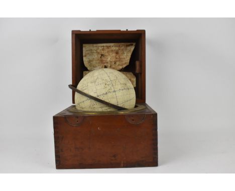 An early 20th century H Hughes &amp; Sons celestial globe in a mahogany case, the hinged lid enclosing 'The Husan Star Globe'