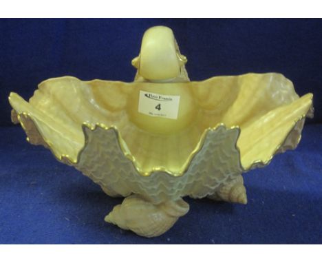 Royal Worcester porcelain shell shaped bowl with gilded rim and peach ground.  Printed marks to base with partially illegible