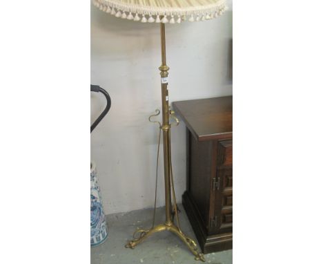 Heavy brass standard double oil burner lamp on triform base with shade.(B.P. 24% incl. VAT)