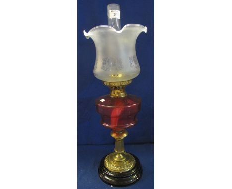 Early 20th Century brass double burner oil lamp with ceramic reservoir, brass pedestal and ceramic base, etched glass shade a