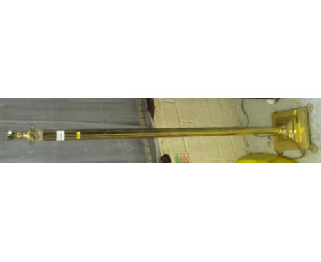 Classical design brass standard lamp on square stepped base and paw feet.(B.P. 24% incl. VAT)