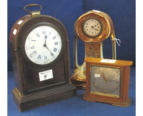 Late 19th Century French arch topped mantel clock with loop handle, enamel face with Roman and Arabic numerals and French bra