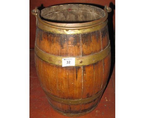 Coopered barrel shaped bucket on stick stand with iron swing handle. 41cm high. (B.P. 24% incl. VAT)