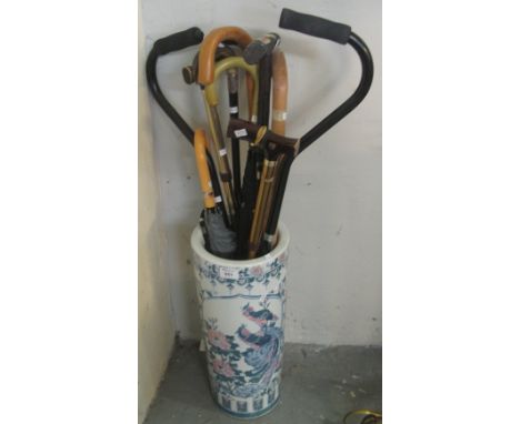 Modern ceramic stick stand comprising various sticks and umbrellas etc.(B.P. 24% incl. VAT)