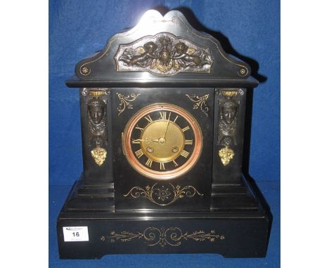 Late 19th Century black slate, architectural, metal mounted, two train mantel clock, with enamelled face, having Roman numera
