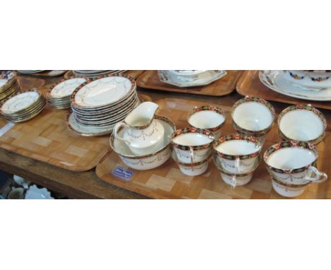 Two trays of Royal Albert Crown china teaware on a white ground with gilt swag and floral decoration comprising: teacups and 