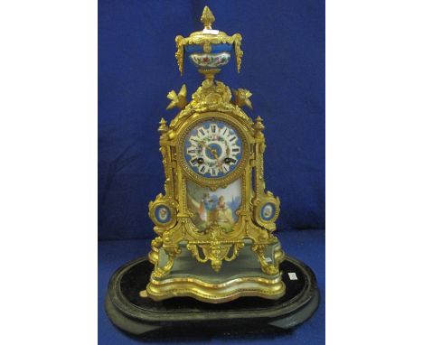 19th Century French Ormolu architectural mantel clock with porcelain, urn shaped finial, porcelain panels and painted porcela