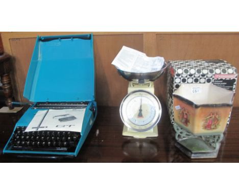 SCM typewriter together with a Typhoon, coloured kitchen scales in original box and a Staffordshire figural planter. (3) (B.P