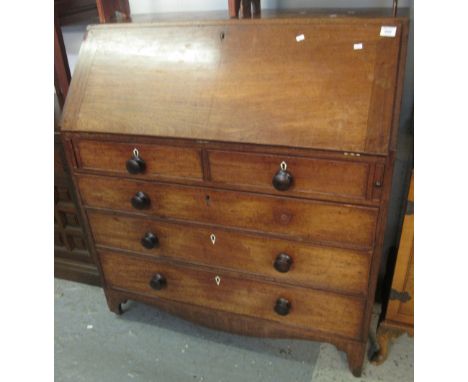 19th Century mahogany fall front bureau, having turned handles, ivory escutcheons on shaped apron and bracket feet.(B.P. 24% 