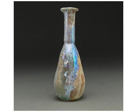 100-300 AD. Roman. Pale blue(?) glass unguentarium with outward flaring rim, long, slightly flaring neck and bell-shaped body