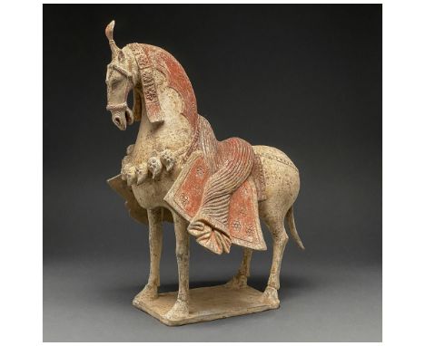 C. 386-534 AD. Northern Wei Dynasty. A painted pottery figure of a horse. The horse stands foursquare with its head drawn inw