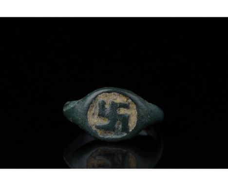 700-1100 AD, Viking Age. Beautiful bronze ring comprised of an open D-shaped hoop, and a circular bezel bearing a swastika. t
