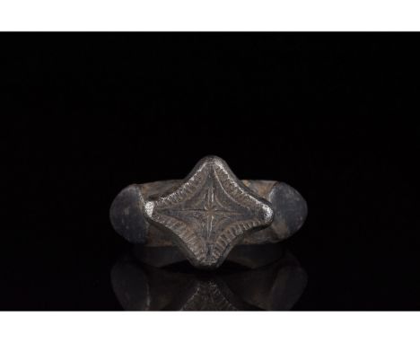 1000-1500 AD, Crusader Period. A heavy silver ring with a circular hoop, flattened shoulders, and pedestalled, lozenge-shaped