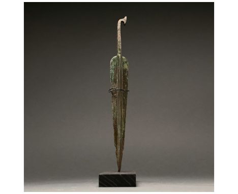 1200-700 BC, Greek Archaic Period. This beautiful cast bronze sword has a tapering, bevelled blade with a raised midrib and a