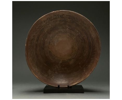 C. 3rd millennium BC. Indus Valley Civilisation. A large painted bowl with a hemispherical body and ring foot. The bowl, in a