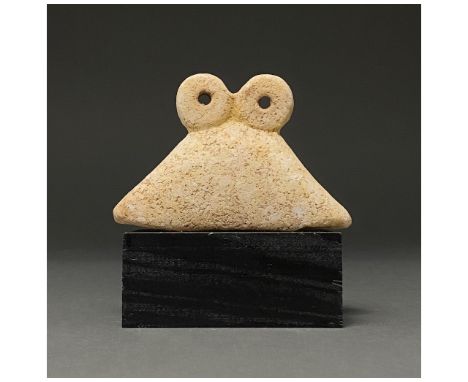 Ca.4000 BC. Western Asiatic. Attractive creme coloured stone Tell Brak Eye Idol consisting of a traingular and two circular e