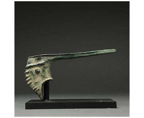 C. 2000-700 BC. Bronze Age. A bronze battle axe with an elongated, spiked blade, rounded socket and reinforced, flanged butt,