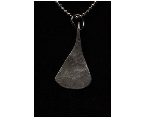 700-1100 AD, Viking Age. A silver example of an axe or Perun amulet comprising a suspension loop and a stylised axe head. Thi