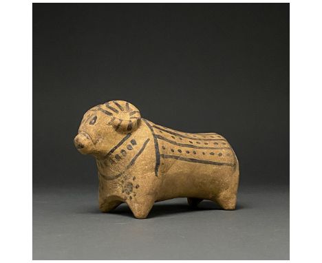 C. 3rd millennium BC. Indus Valley Civilisation. Cream-coloured pottery ram figure with painted black details, curved horns s