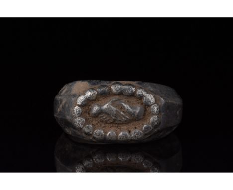 100-300 AD, Roman. Silver ring with a D-Shaped hoop, raided circular decoration on the bezel and an oval-shaped frame with 'd