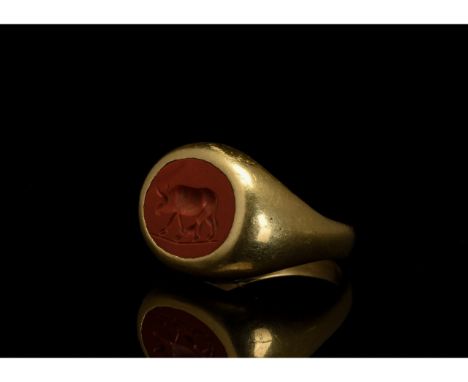 CA. 100 AD. ROMAN SOLID GOLD INTAGLIO RING WITH BULL . In order to confirm its authenticity, this piece has undergone X-Ray F